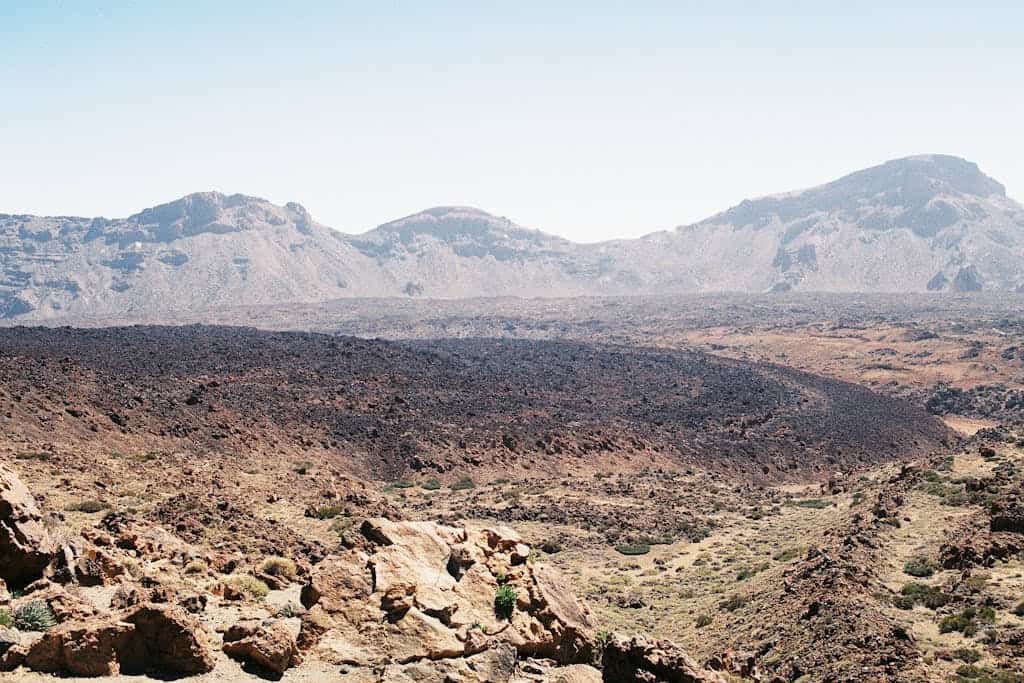 Explore the barren and eroded volcanic terrain of Teide National Park, Tenerife.